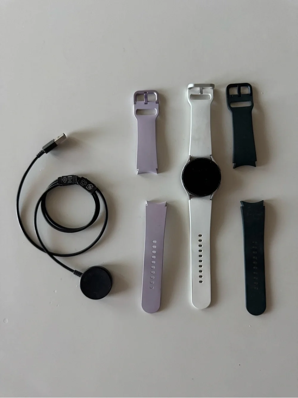 Samsung Galaxy Watch 4 - 40mm with White, Green, and Lavender Silicone Bands